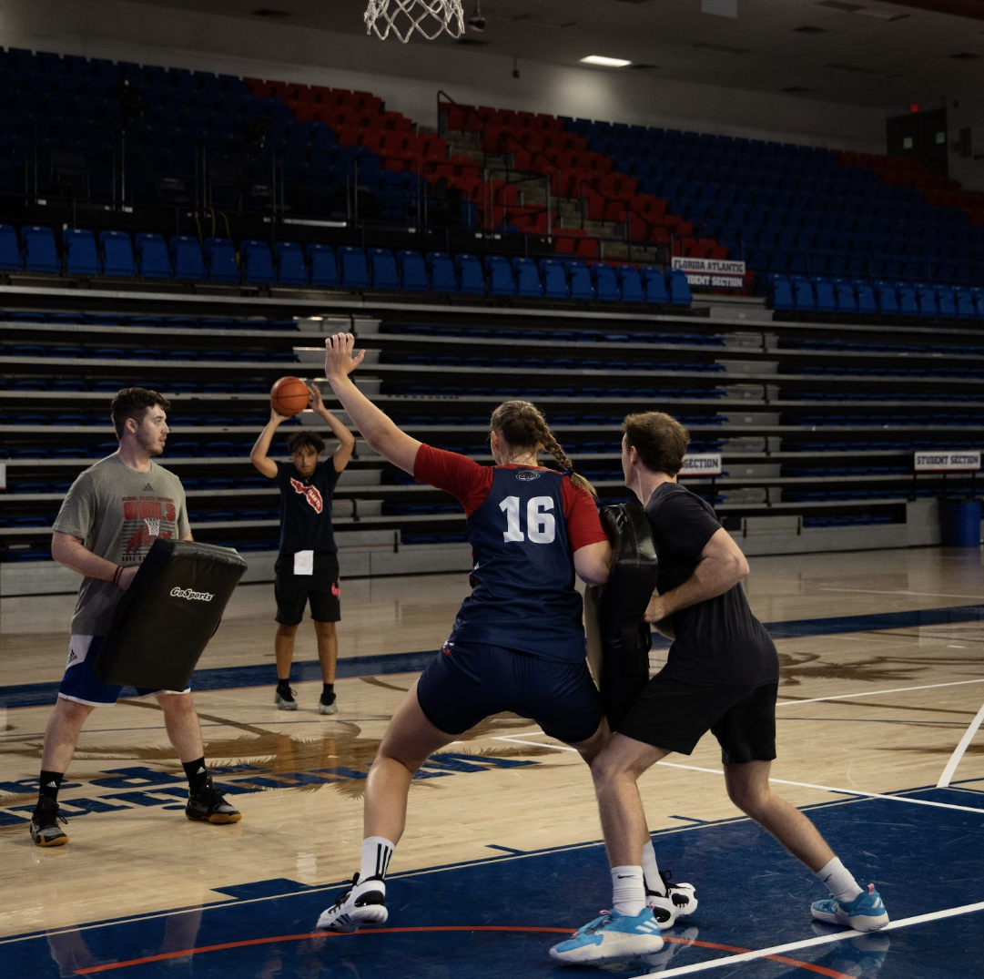 Practice player Brian Day in a defensive drill against center Lovisa Asbrink Hose during practice on Oct. 3. 